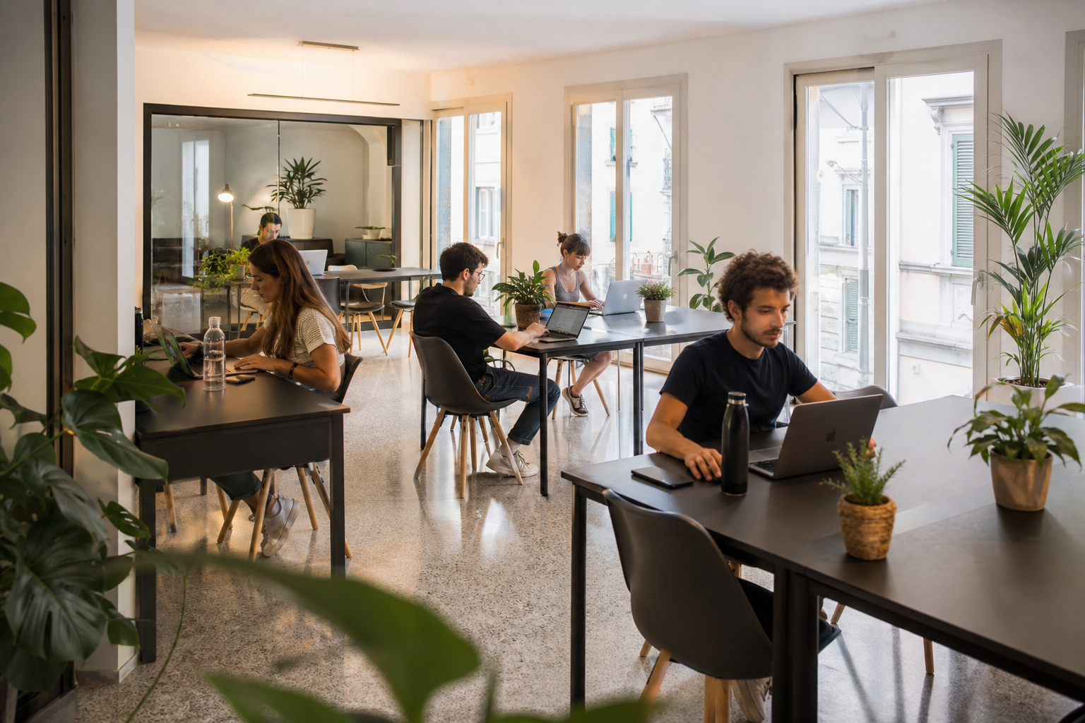 Area coworking in contesto coliving — illustrazione informativa trend professionisti